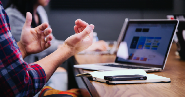 An image of a digital worker training another worker.