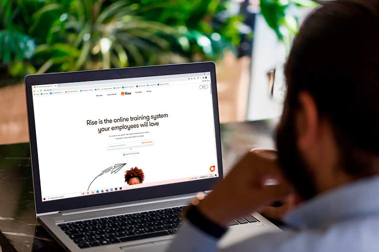A person using Rise.com on a laptop