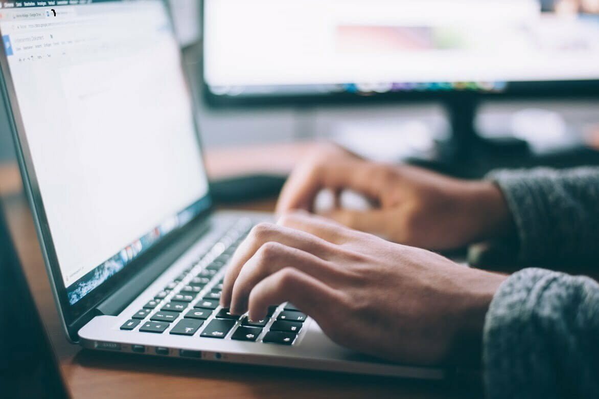 Image of someone using a laptop to take an eLearning course