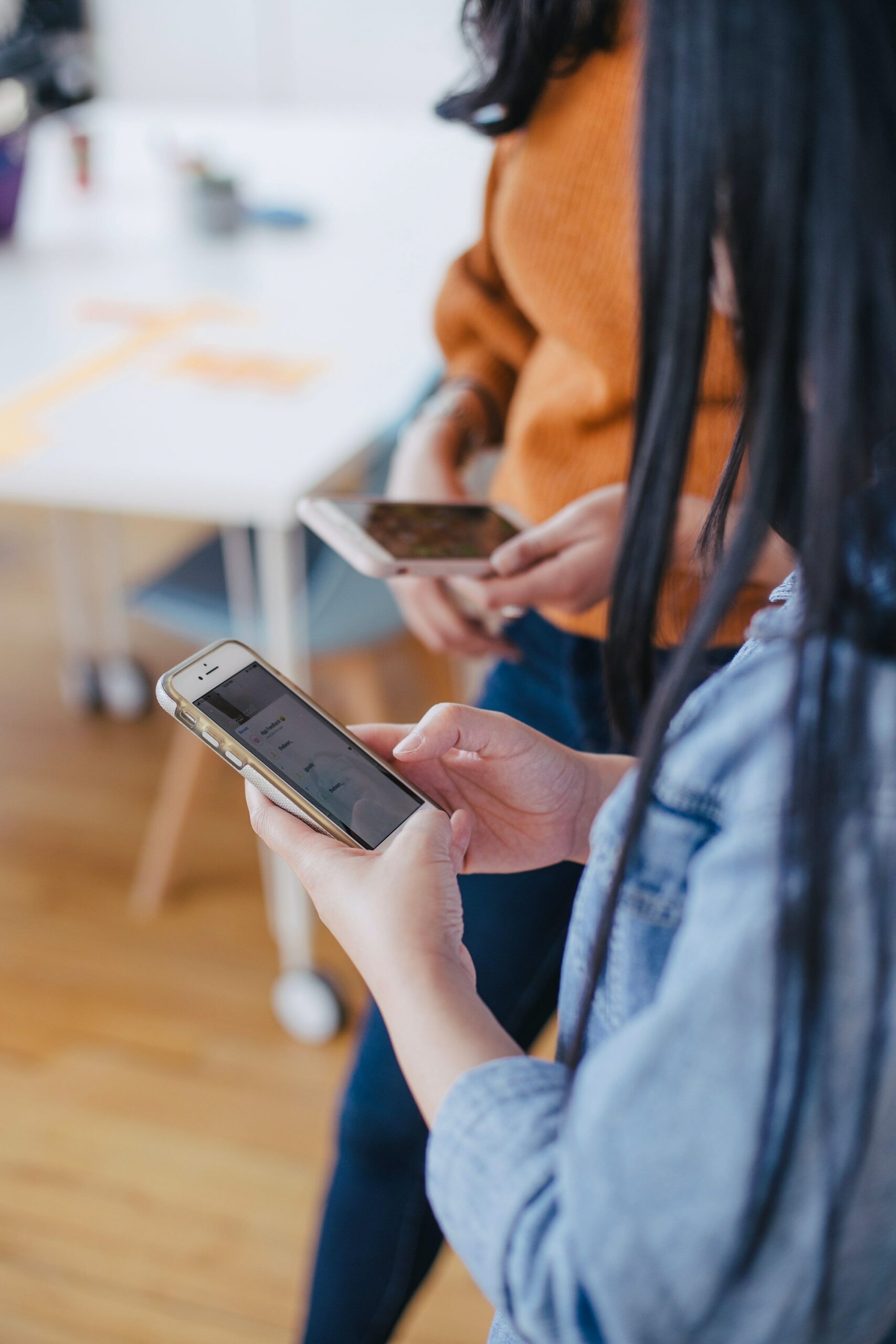 Image of someone using a mobile phone to take a course