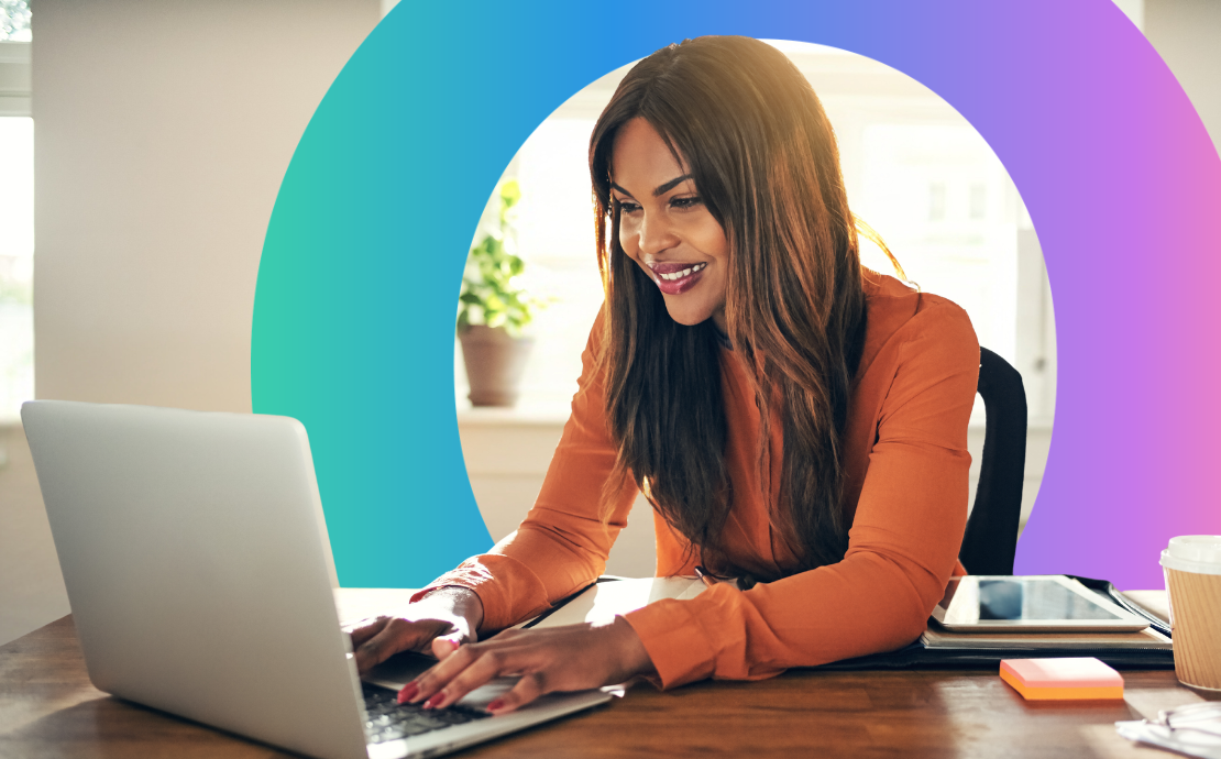 Woman sat at a desk typing on her laptop; Omniplex Learning circle icon in the background